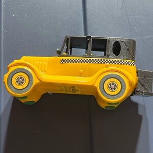 Vintage Yellow and Black Cab Avon cologne bottle.